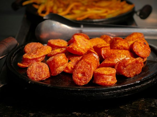 a plate full of hot dogs on a counter